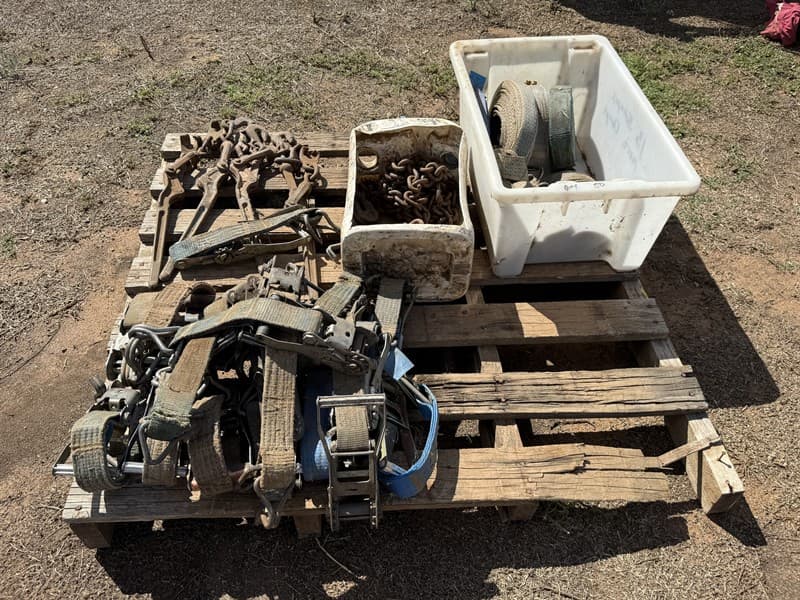 PALLET OF RATCHET STRAPS CHAINS AND DOGS. Will have an extra 10 straps and ratchets not in photo.