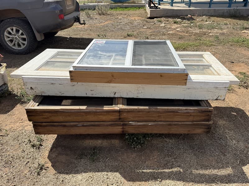 ASSORTED WINDOW FRAMES AND DOOR. Window #1 950 x 945. Door measures 1035 x 820. Window # 2 1800 x 680. 2 x windows at 1573 x 1030.