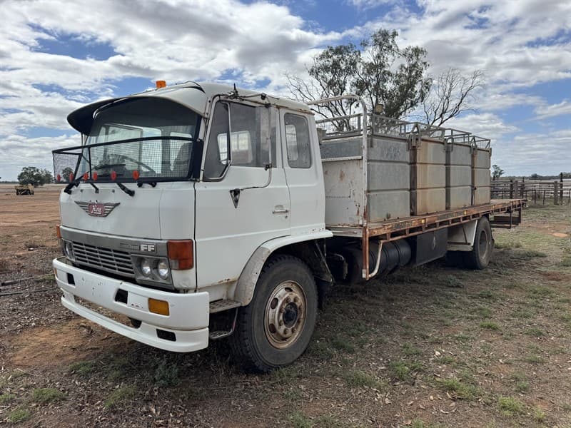 Hino FF Water Truck. Odometer: 796719. 4 tanks with a total of 9000L capacity. 5-speed manual with a 2-speed rear differential. Battery isol…