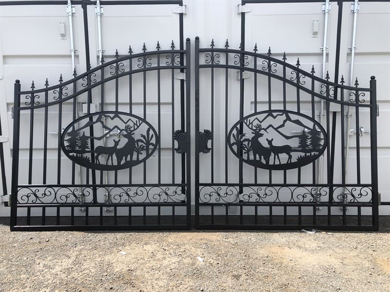 Set of 2 Small Unused Wrought Iron Style Gates with Wildlife Scene, Each gate is 7ft wide, Height at High Side: 2.3m, Height at Low Side: 1.…