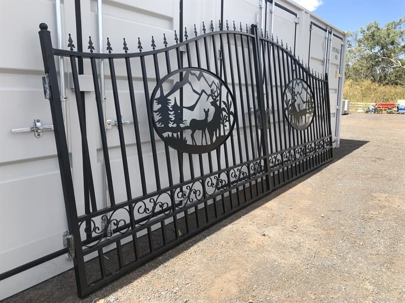 Set of 2 Large Unused Wrought Iron Style Gates with Wildlife Scene, Each gate is 10ft wide, Height at High Side: 2.3m, Height at Low Side: 1…