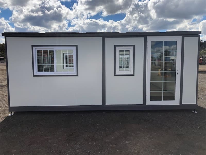 Unused Portable Foldout House, Model: 0207, Includes: 8 Sliding lockable Windows, 1 x Door, Timber look flooring, Gas struts & winches for e…