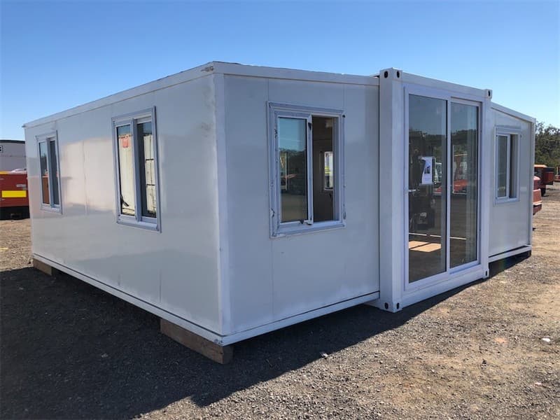 Unused 20ft Portable Fold Out Container House, Includes: 1 Large Sliding Door, 8 Sliding Windows, Timber look flooring, Approximate Size whe…