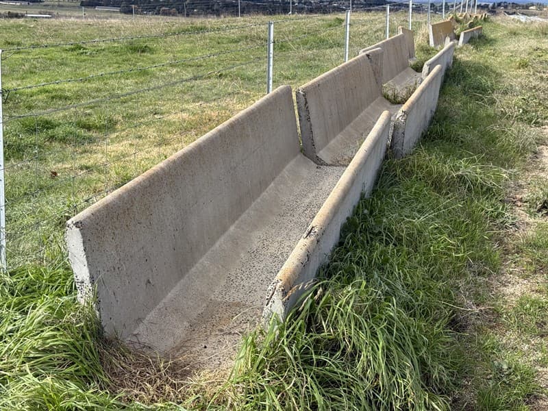 5 X CONCRETE FEED TROUGHS. Solid troughs measuring 3m long x 0.780m wide x 0.5m high at front and 0.7m at rear. Broken corners on 2 as shown…