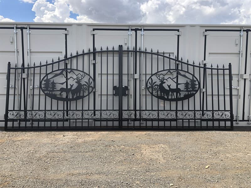 Set of 2 Large Unused Wrought Iron Style Gates with Wildlife Scene, Each gate is 10ft wide, Height at High Side: 2.3m, Height at Low Side: 1…