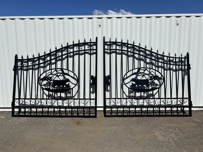 Set of 2 Large Unused Wrought Iron Style Gates with Cow Scene, Each gate is 9ft wide, Height at High Side: 2.3m, Height at Low Side: 1.8m, M…