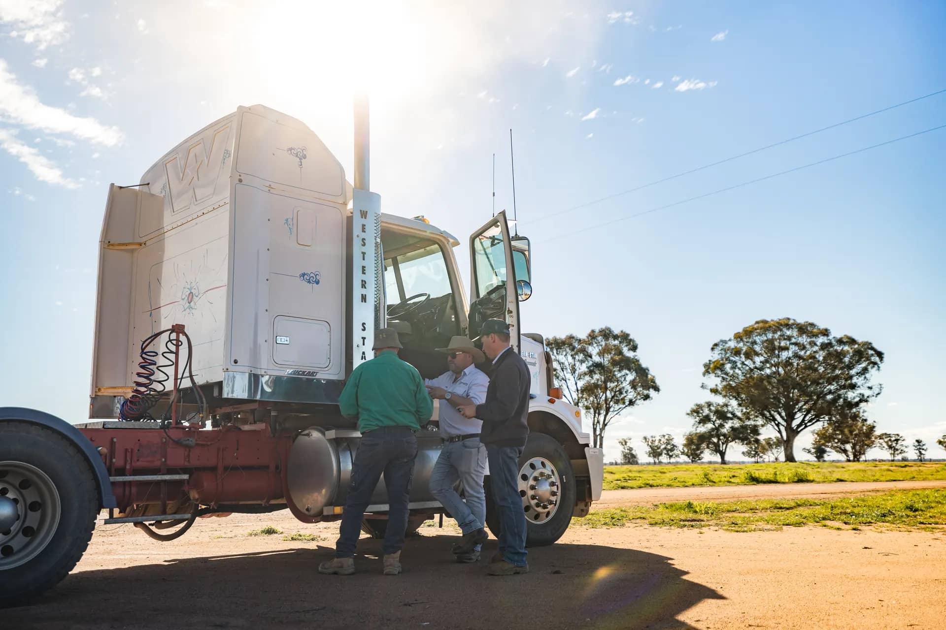 Benabilla agents record details machine-side beside a Western Star prime mover during an on-site inspection